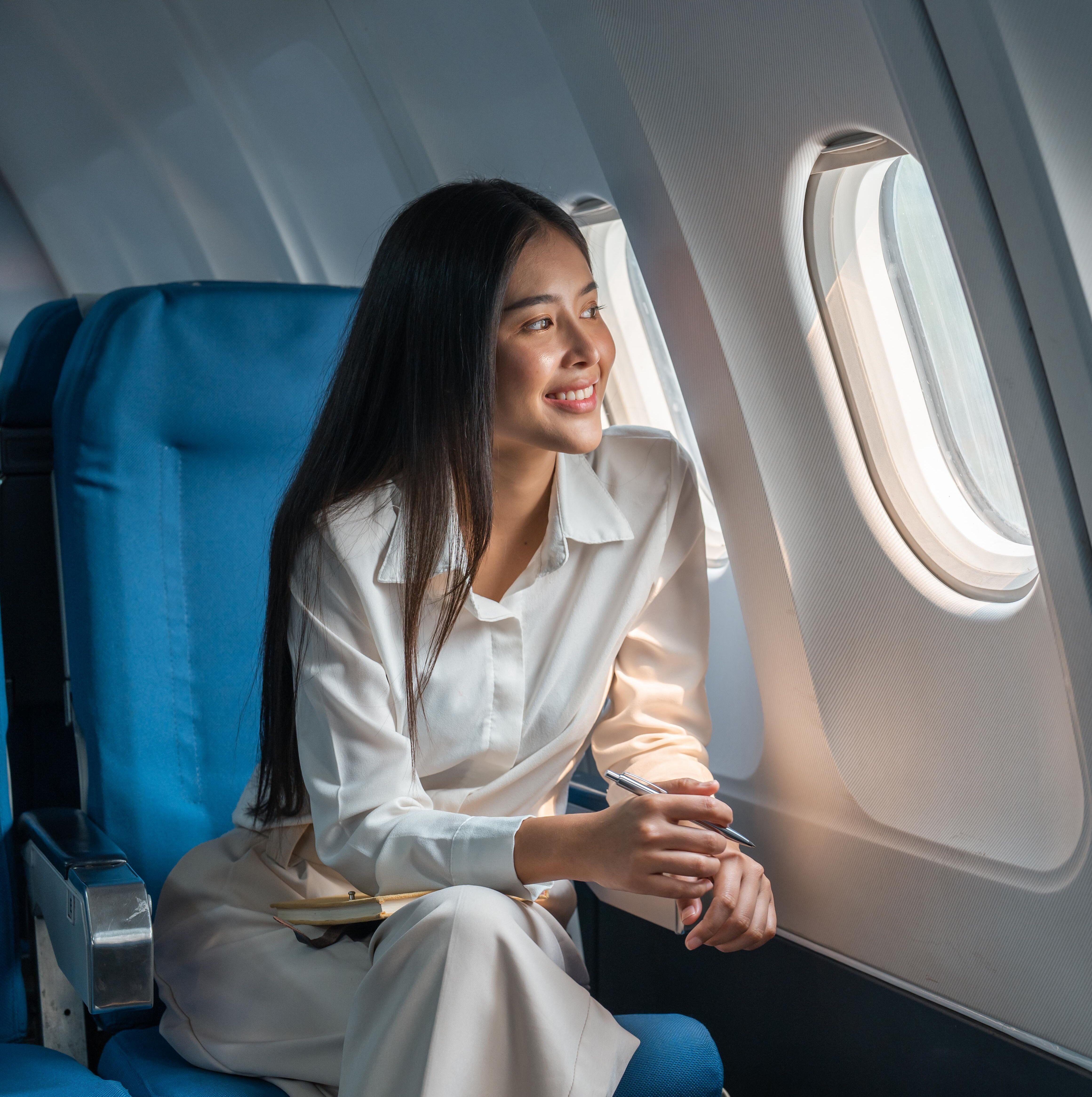 An image of a woman on an airplane.